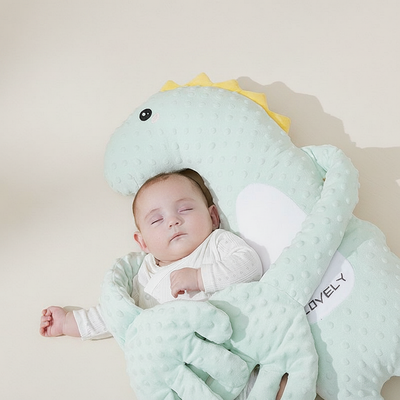 Close-up of an animal-shaped baby pillow filled with PP cotton, on a light background.